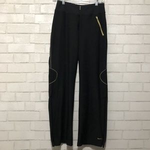 black and gold nike track pants